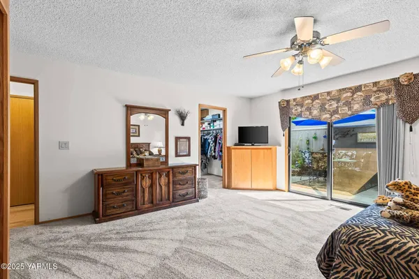 a bed room with a bed and dresser