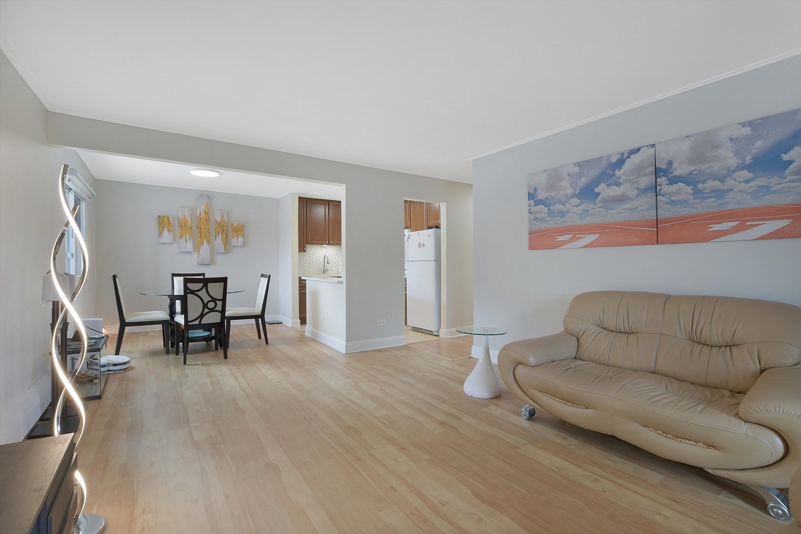 3523 Central Road, Unit 203 Glenview, IL 60025 - Photo 8 of 26 a living room with furniture and a wooden floor