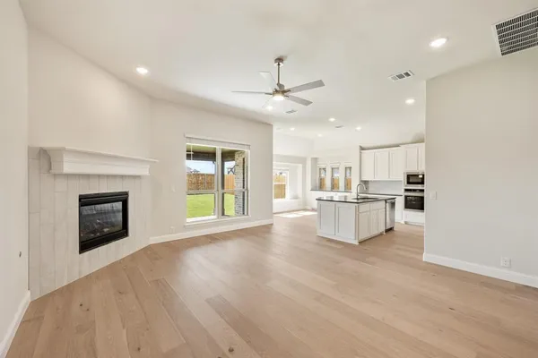 a view of kitchen with furniture and a fireplace