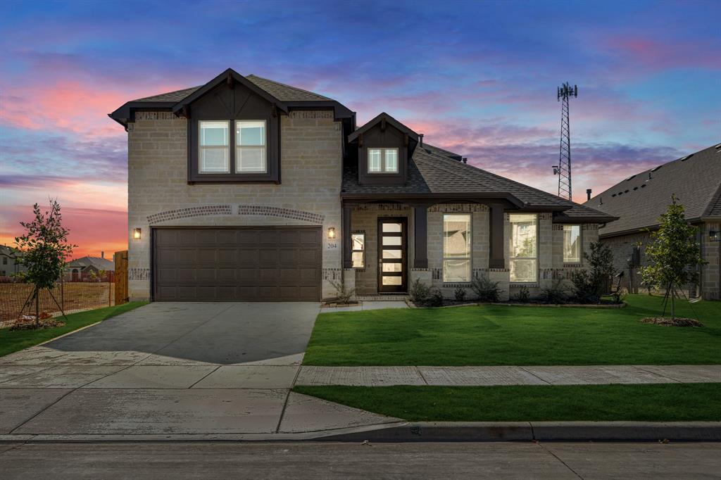 204 Sweetwater Drive Commerce, TX 75428 - Photo 2 of 38 a front view of a house with a yard
