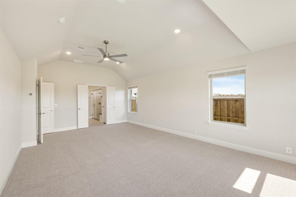 204 Sweetwater Drive Commerce, TX 75428 - Photo 23 of 38 an empty room with a window and a ceiling fan