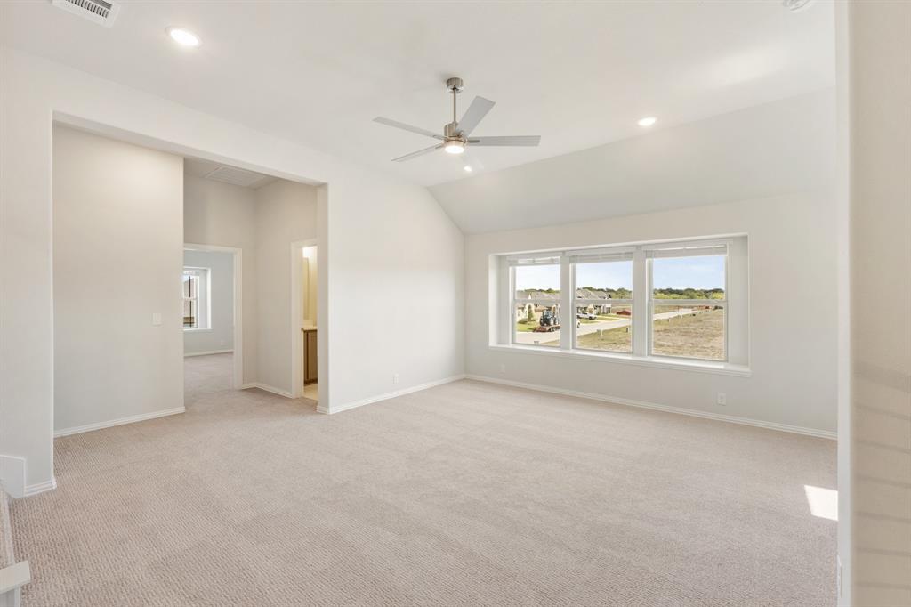 204 Sweetwater Drive Commerce, TX 75428 - Photo 28 of 38 an empty room with fan and windows
