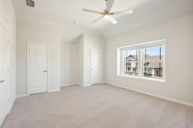 a bathroom with a bathtub shower sink vanity mirror and toilet