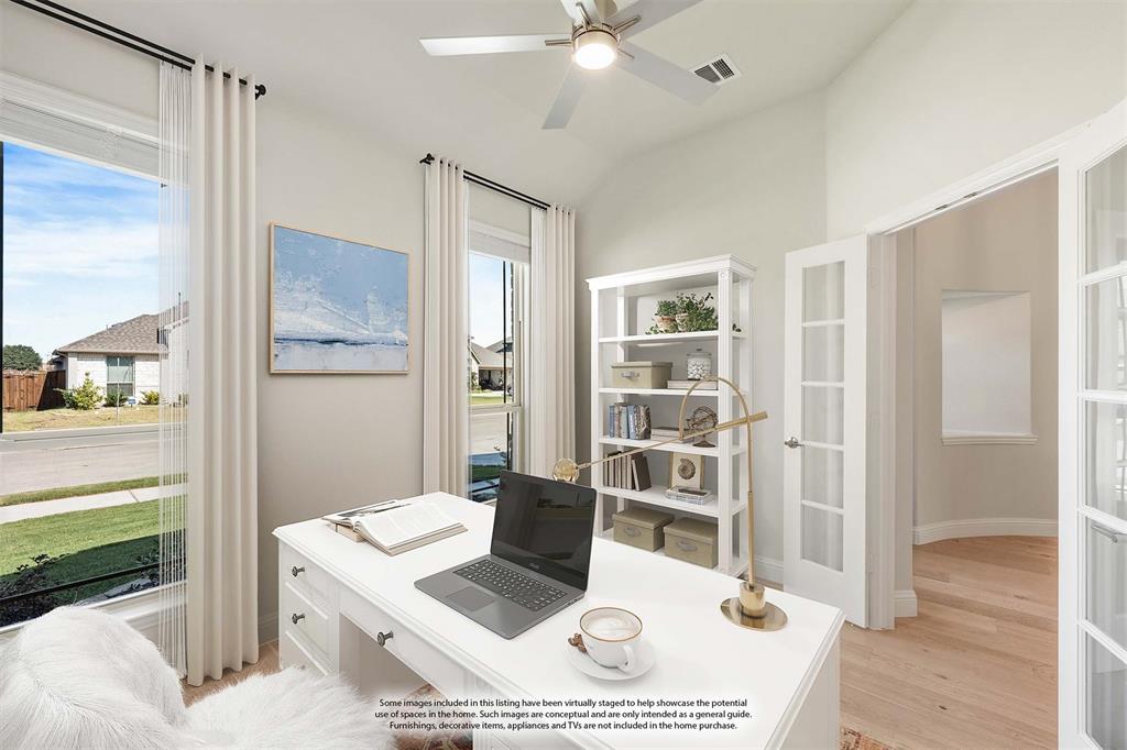 204 Sweetwater Drive Commerce, TX 75428 - Photo 5 of 38 a living room with a bed furniture and a window