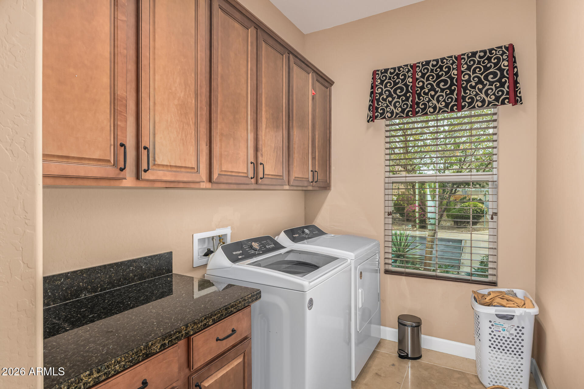 3139 East Harwell Road Phoenix, AZ 85042 - Photo 29 of 45 a view of cabinets and wooden floor