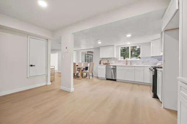 a view of a kitchen with a sink cabinets and a window