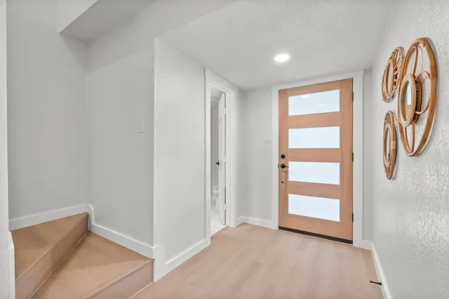 a view of front door with hallway