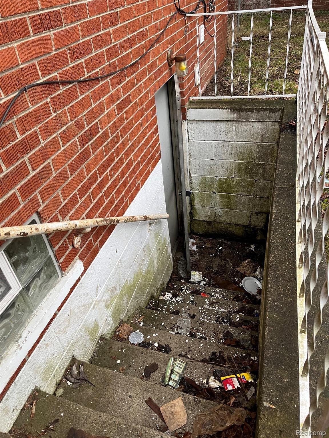 816-818 Alter Road Detroit, MI 48215 - Photo 32 of 33 Stairs and exterior door to basement