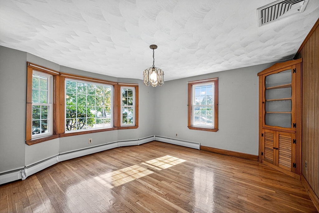 77 Whipple Road Billerica, MA 01821 - Photo 12 of 30 a view of livingroom with hardwood floor and window