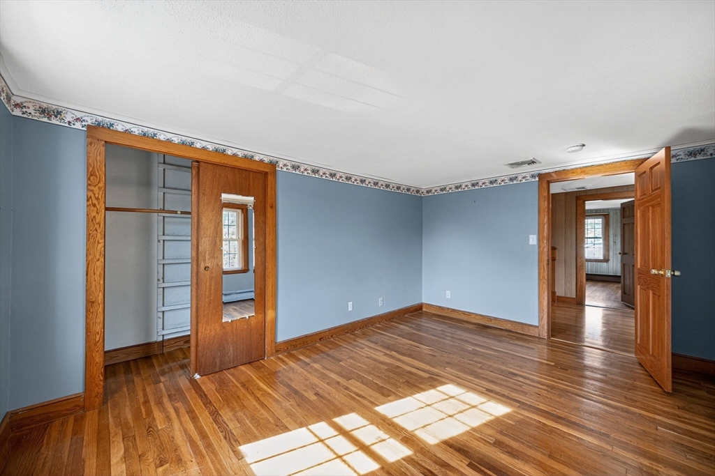 77 Whipple Road Billerica, MA 01821 - Photo 22 of 30 a view of empty room with wooden floor