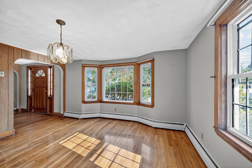 77 Whipple Road Billerica, MA 01821 - Photo 5 of 30 a view of empty room with wooden floor and fan
