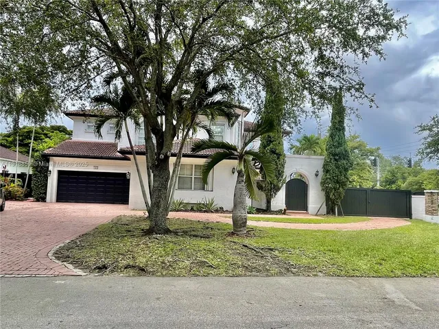 a bedroom with a bed and a chair