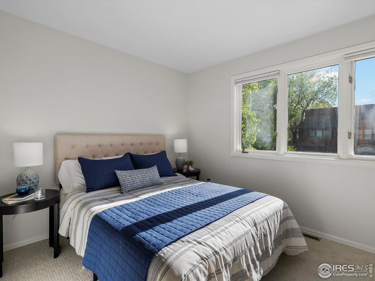 3345 Hickok Place Boulder, CO 80301 - Photo 18 of 34 a bedroom with a large bed and a large window