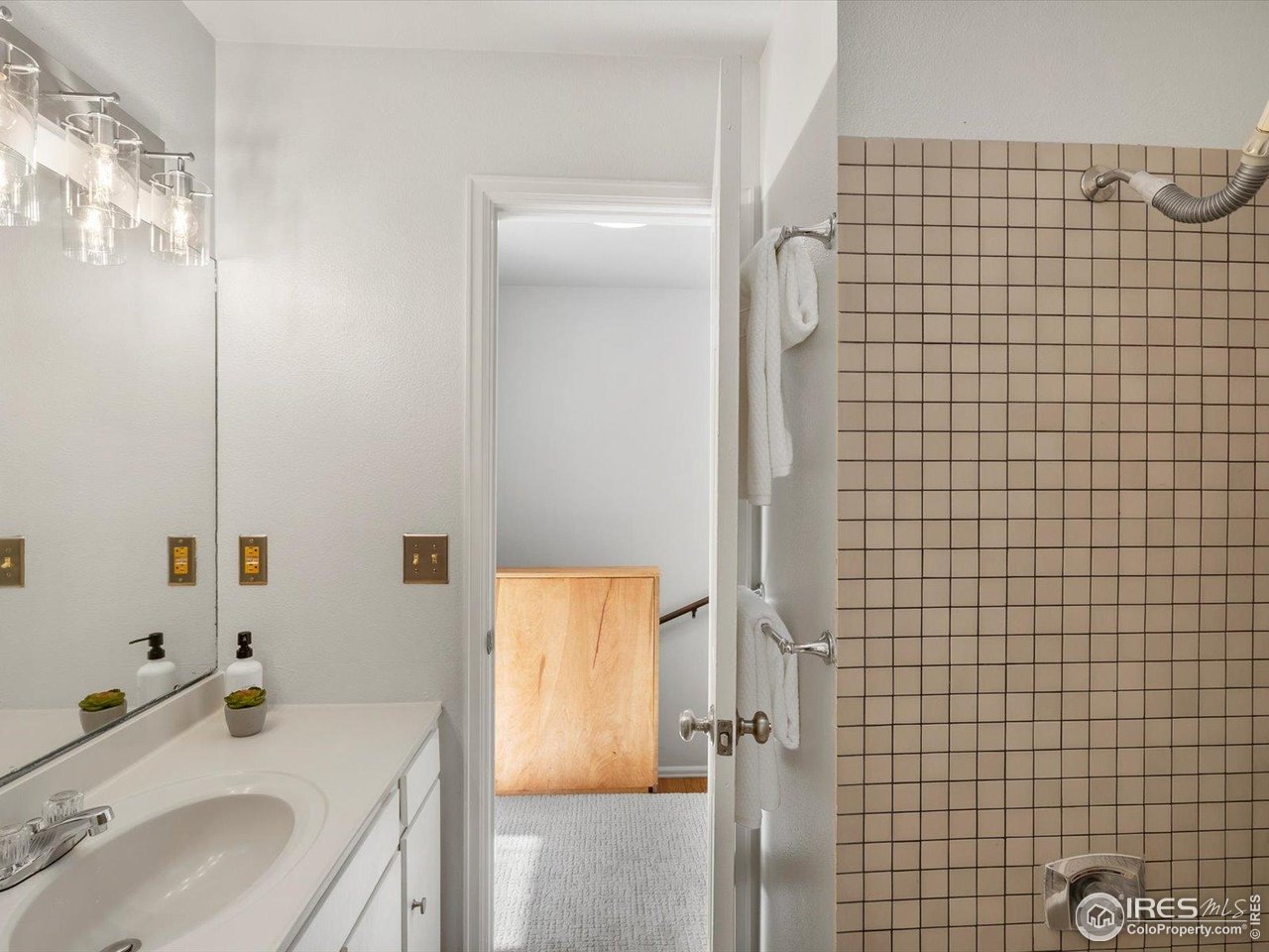3345 Hickok Place Boulder, CO 80301 - Photo 22 of 34 a bathroom with a sink a mirror and shower