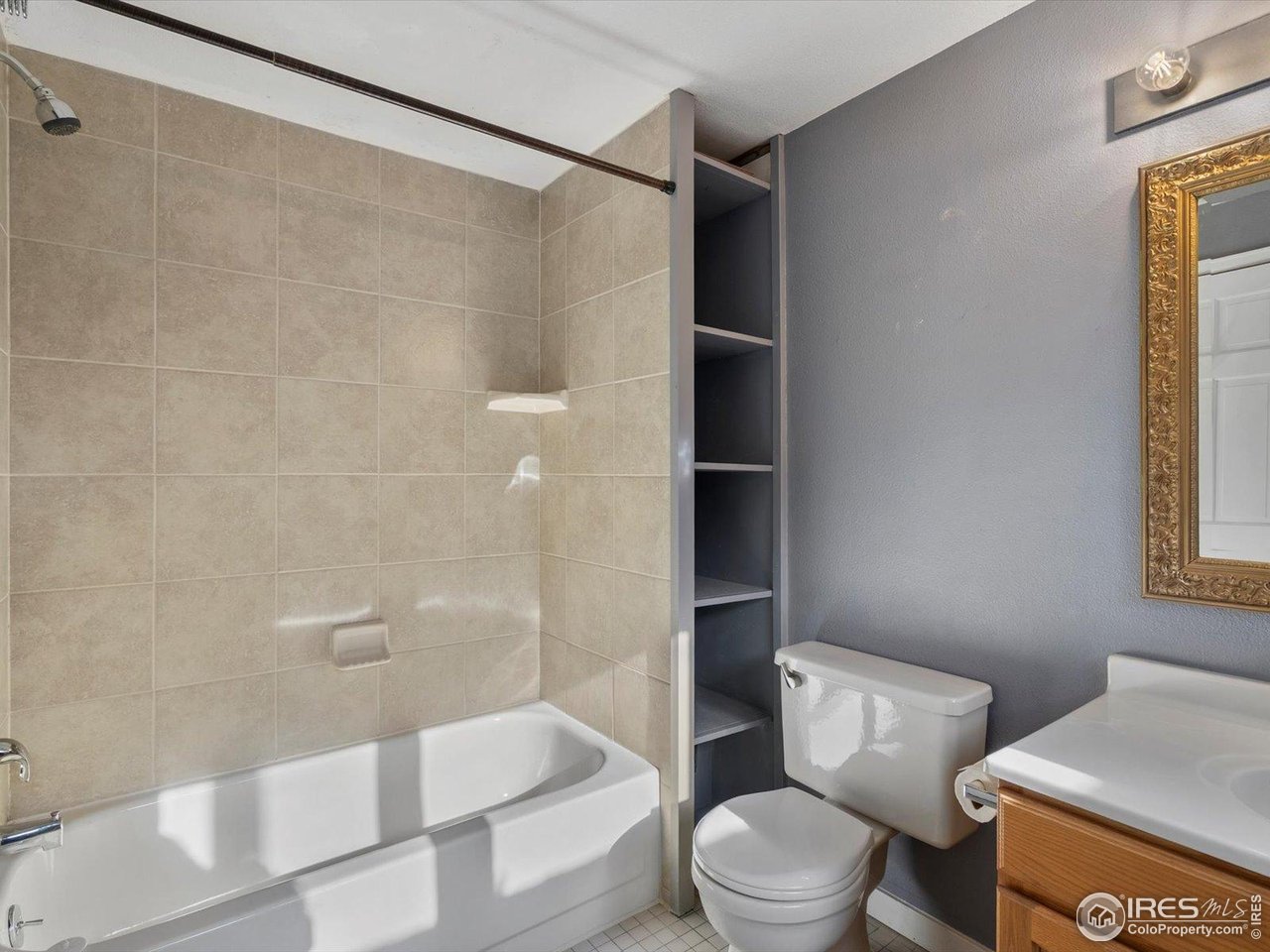 3345 Hickok Place Boulder, CO 80301 - Photo 26 of 34 a white toilet sitting next to a bath tub and a shower