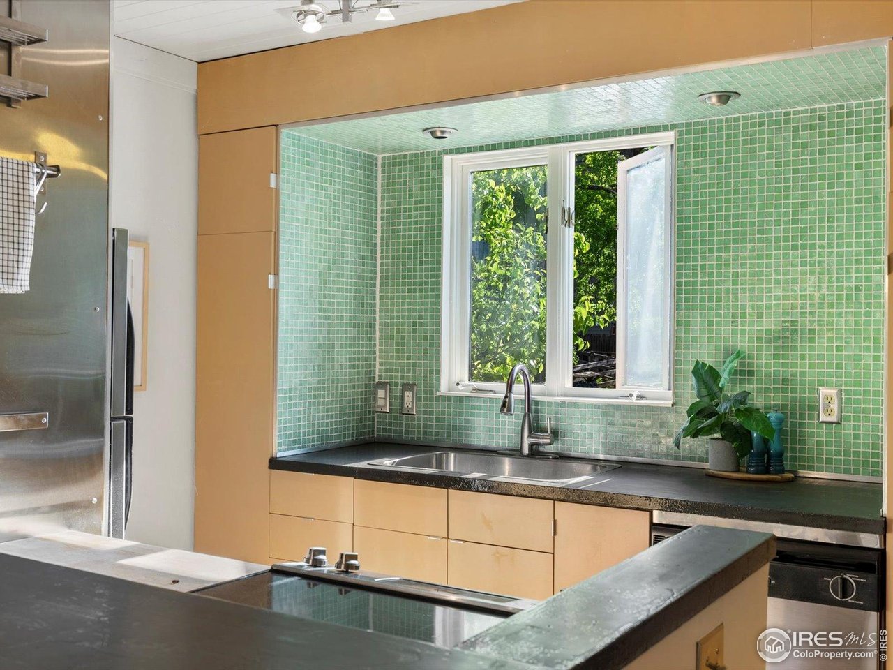 3345 Hickok Place Boulder, CO 80301 - Photo 4 of 34 a bathroom with a granite countertop sink and a large mirror