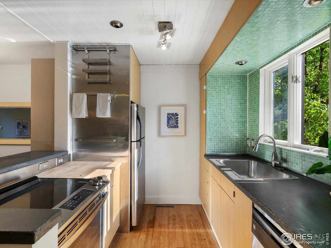 3345 Hickok Place Boulder, CO 80301 - Photo 5 of 34 a kitchen with granite countertop a sink and a stove top oven