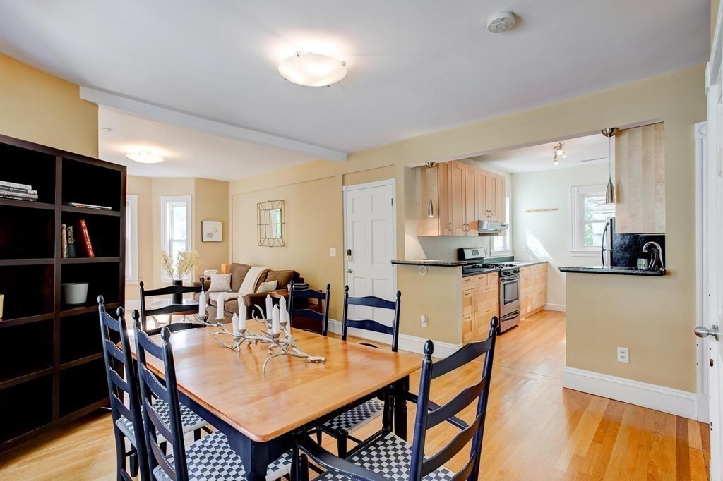 59 Creighton Street, Unit 2 Cambridge, MA 02140 - Photo 13 of 38 a view of a dining room with furniture and a kitchen