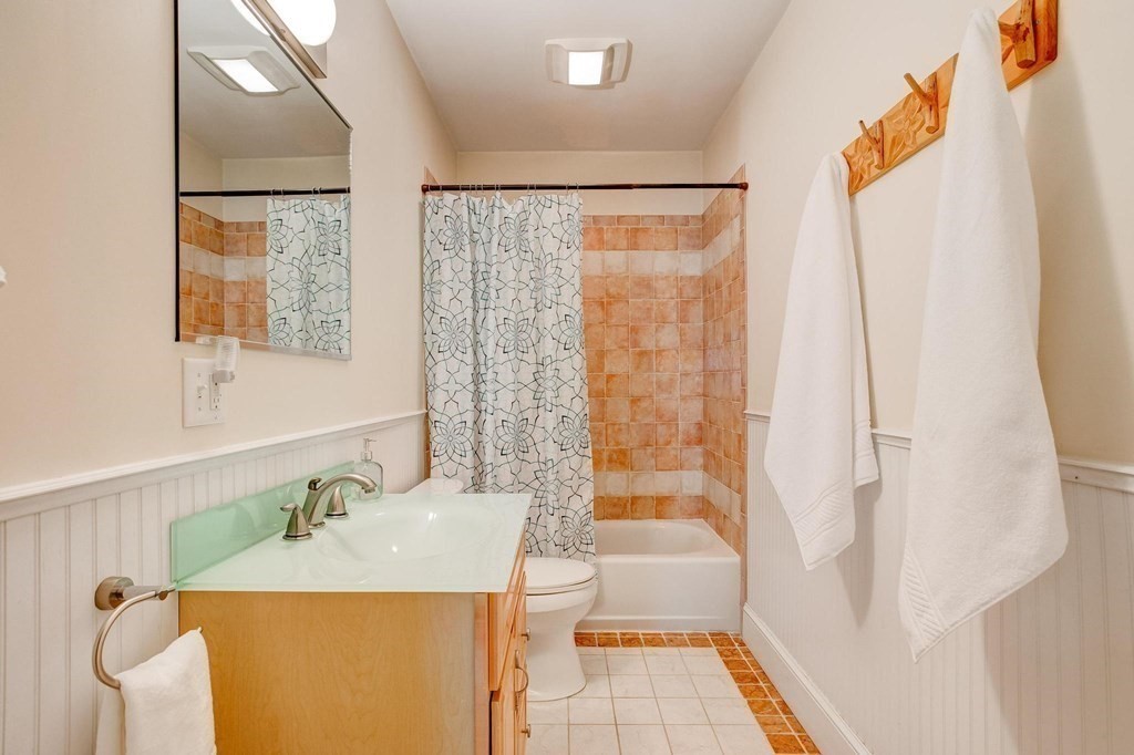 59 Creighton Street, Unit 2 Cambridge, MA 02140 - Photo 15 of 38 a bathroom with a sink and a mirror