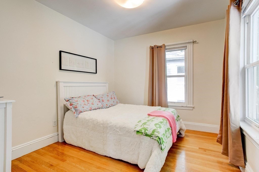 59 Creighton Street, Unit 2 Cambridge, MA 02140 - Photo 21 of 38 a bedroom with a bed and a window
