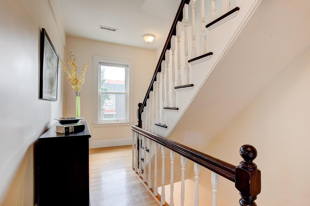 59 Creighton Street, Unit 2 Cambridge, MA 02140 - Photo 24 of 38 a view of entryway with a window and wooden floor