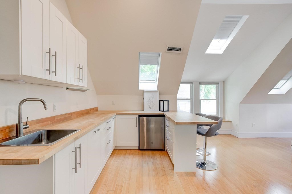 59 Creighton Street, Unit 2 Cambridge, MA 02140 - Photo 28 of 38 a kitchen with a sink cabinets and window
