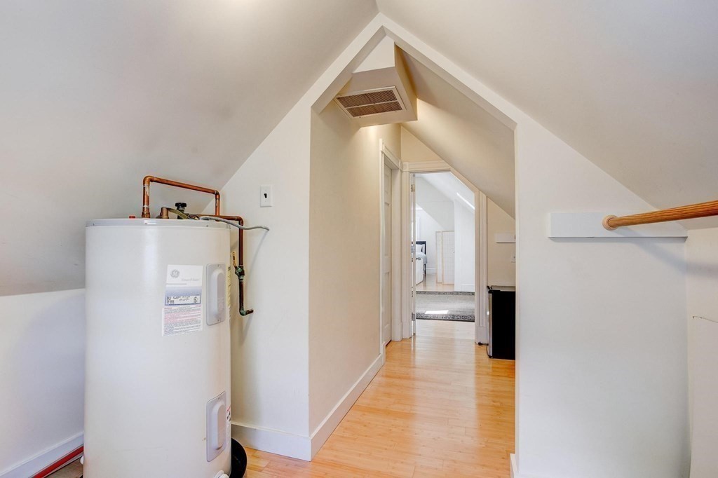 59 Creighton Street, Unit 2 Cambridge, MA 02140 - Photo 36 of 38 a view of a hallway with a white walls