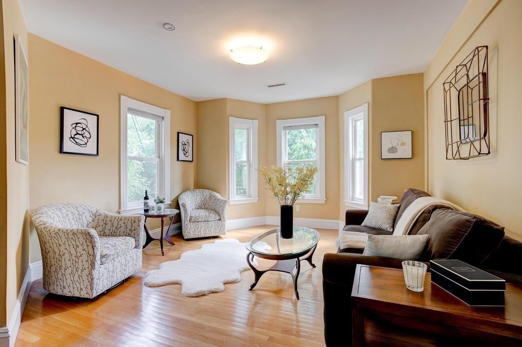 59 Creighton Street, Unit 2 Cambridge, MA 02140 - Photo 7 of 38 a living room with furniture and wooden floor