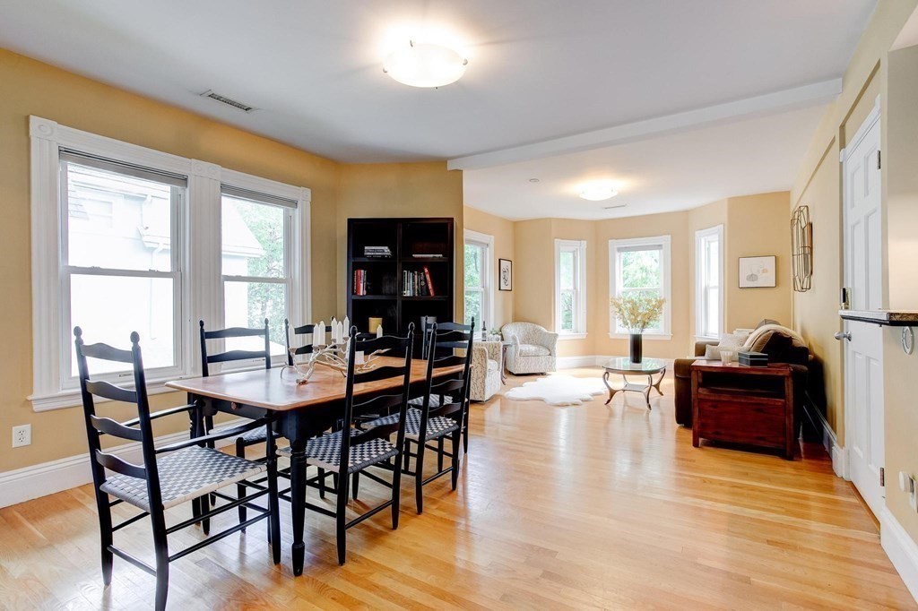 59 Creighton Street, Unit 2 Cambridge, MA 02140 - Photo 8 of 38 a view of a dining room with furniture window and wooden floor
