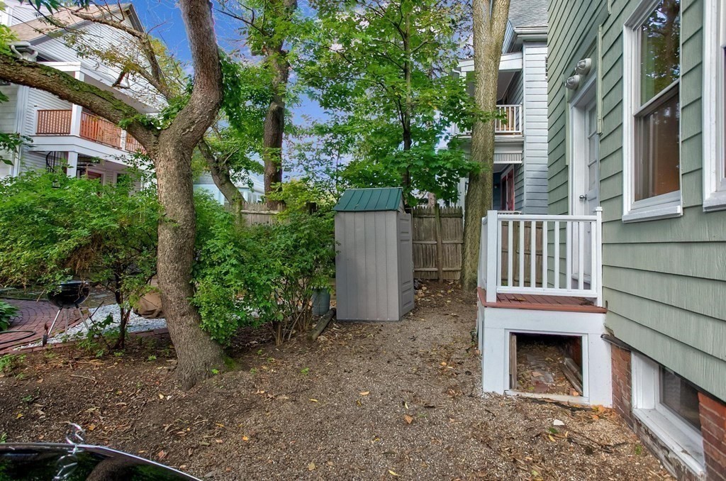 59 Creighton Street, Unit 2 Cambridge, MA 02140 - Photo 10 of 38 front view of a house with a yard