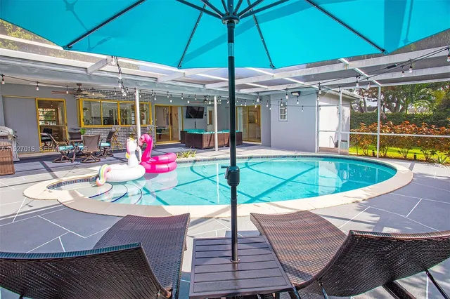 a outdoor living space with furniture and a flat screen tv