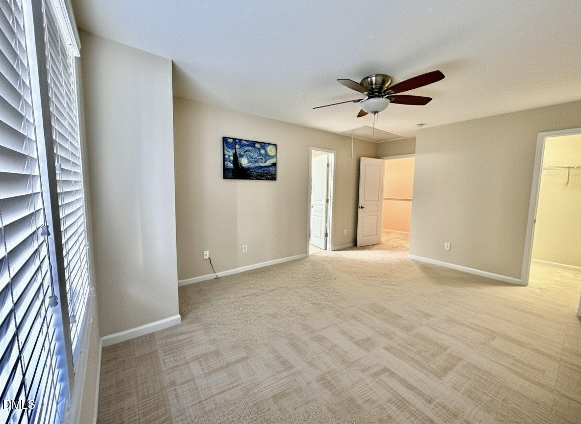 1345 Still Monument Way Raleigh, NC 27603 - Photo 15 of 21 an empty room with windows and fan