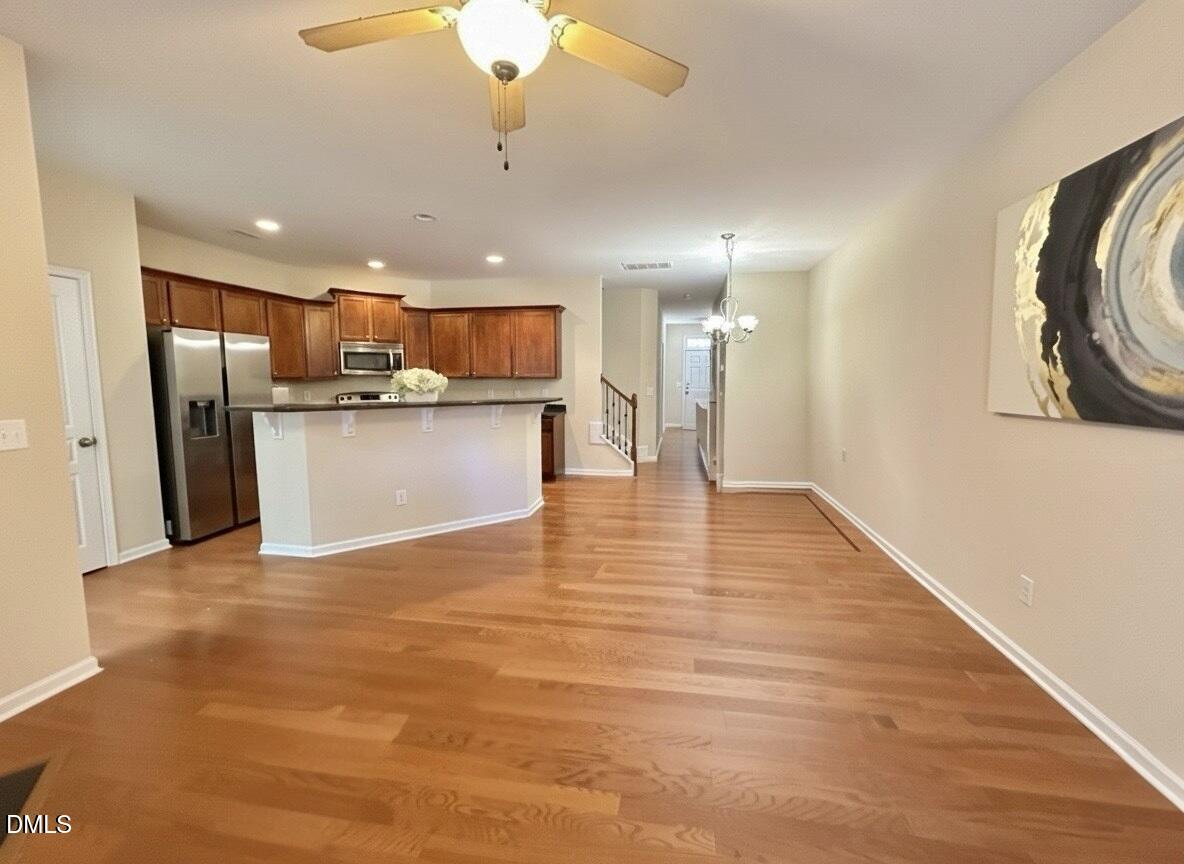 1345 Still Monument Way Raleigh, NC 27603 - Photo 2 of 21 a view of a kitchen with a sink and a refrigerator