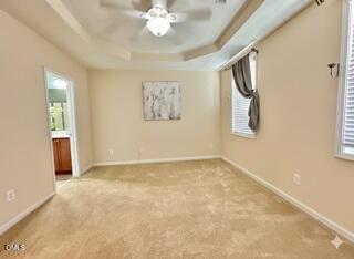 1345 Still Monument Way Raleigh, NC 27603 - Photo 9 of 21 en empty room with windows and chandelier fan