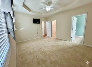 1345 Still Monument Way Raleigh, NC 27603 - Photo 10 of 21 en empty room with windows and ceiling fan