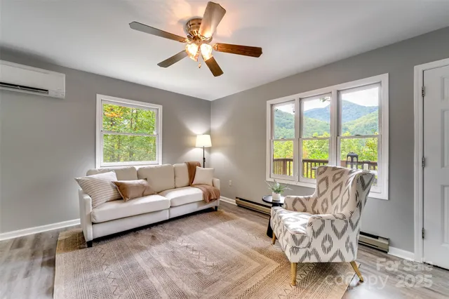 a living room with furniture and windows