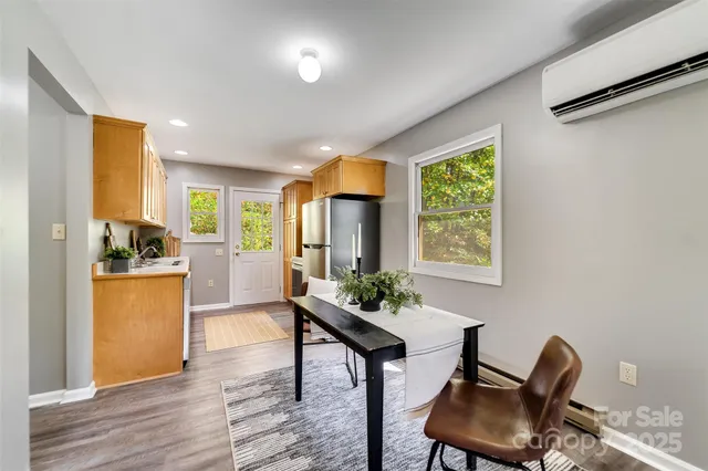 a view of a dining room with furniture window and outside view