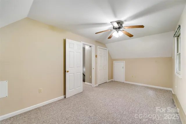 a view of a chandelier fan in a room