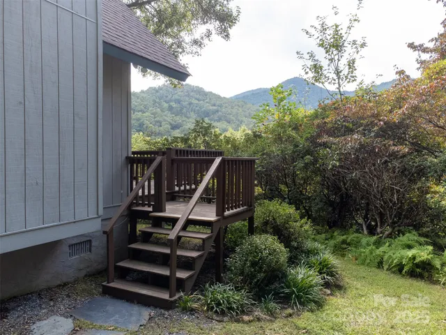 a view of a two chairs in the balcony