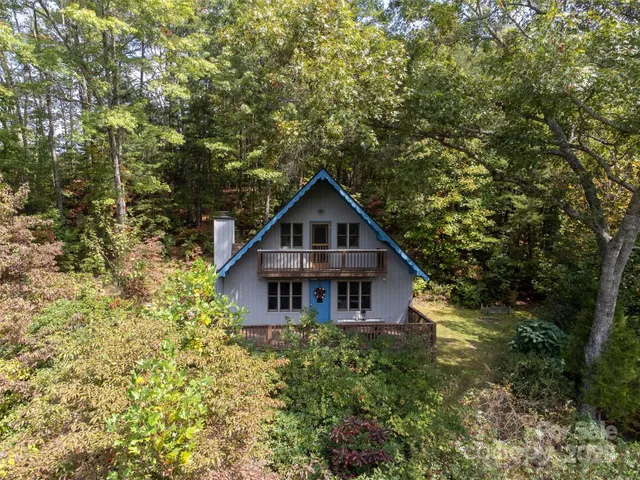 a house with trees in the background