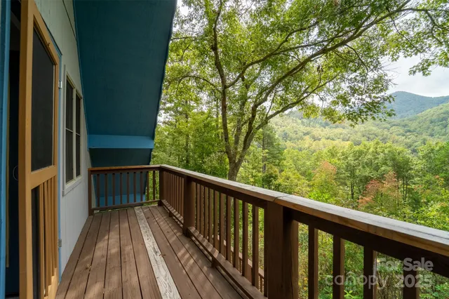 a view of a forest from a balcony