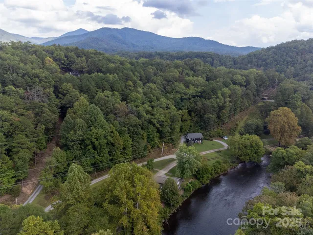 an aerial view of a houses with outdoor space