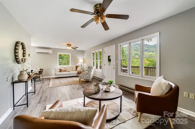 a living room with furniture and a large window