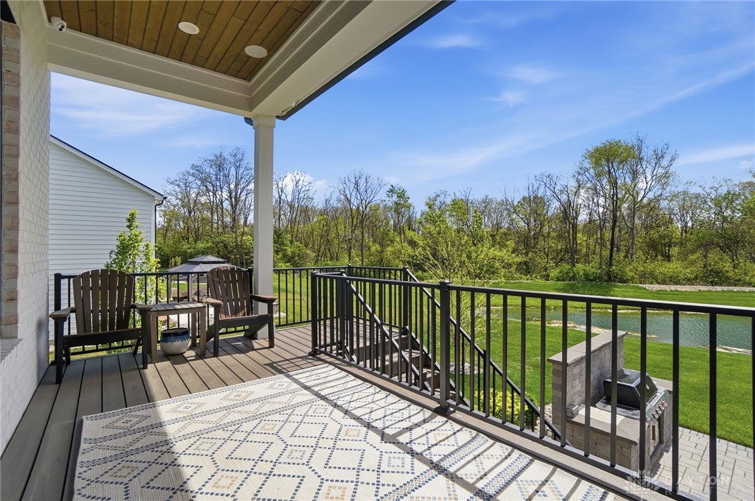 1247 Normandy Rue Dayton, OH 45458 - Photo 65 of 76 This spacious covered deck offers scenic water views, ideal for outdoor entertaining.