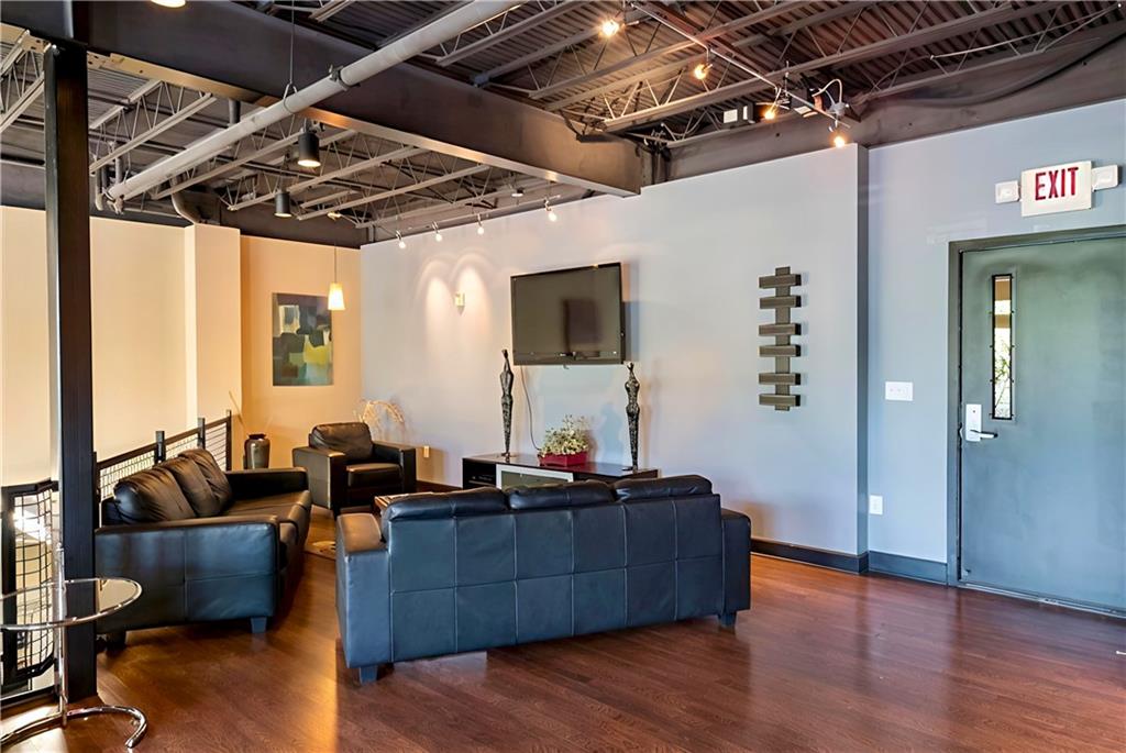 5300 Peachtree Road, Unit 2401 Chamblee, GA 30341 - Photo 21 of 24 a living room with furniture and wooden floor