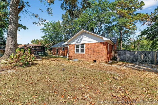 aerial view of a house with large trees