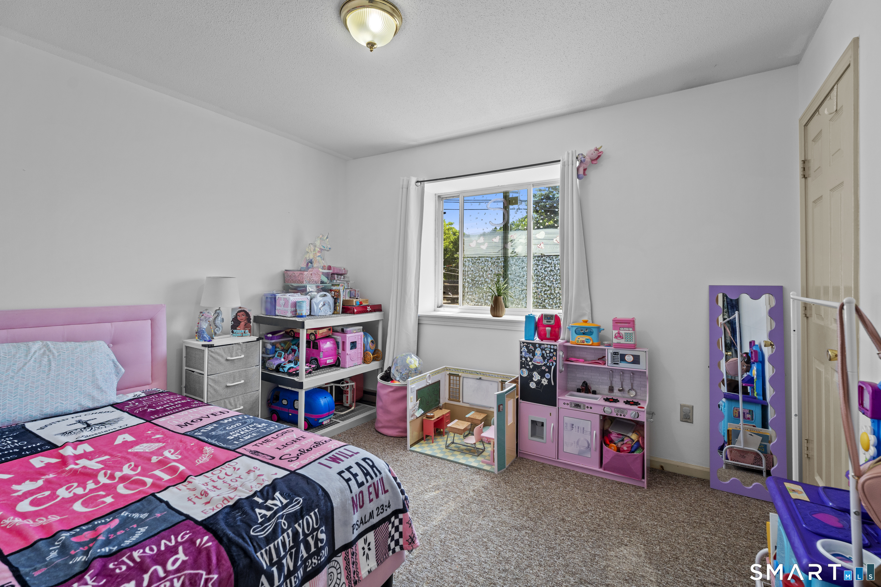 23 Pearl Lake Road, Unit B Waterbury, CT 06706 - Photo 11 of 14 a bedroom with bed and a window