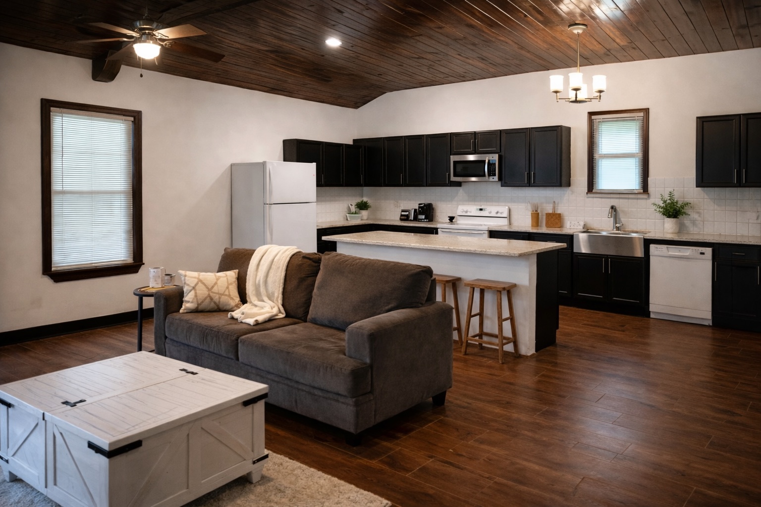 991 Kovar Road, Unit D Flatonia, TX 78941 - Photo 10 of 15 AI used to enchace photo - Living room featuring wooden ceiling, dark wood-type flooring, ceiling fan, vaulted ceiling, and a chandelier