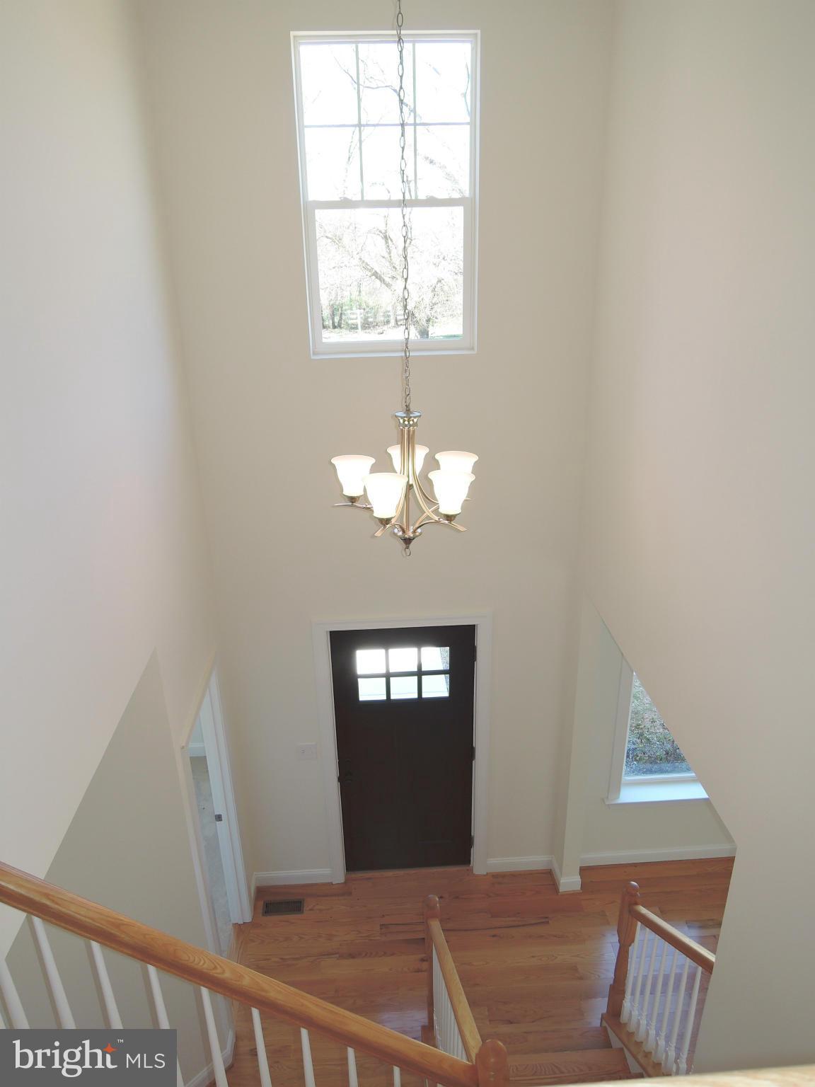 17023 Troyer Road Monkton, MD 21111 - Photo 14 of 30 a view of a chandelier fan and windows