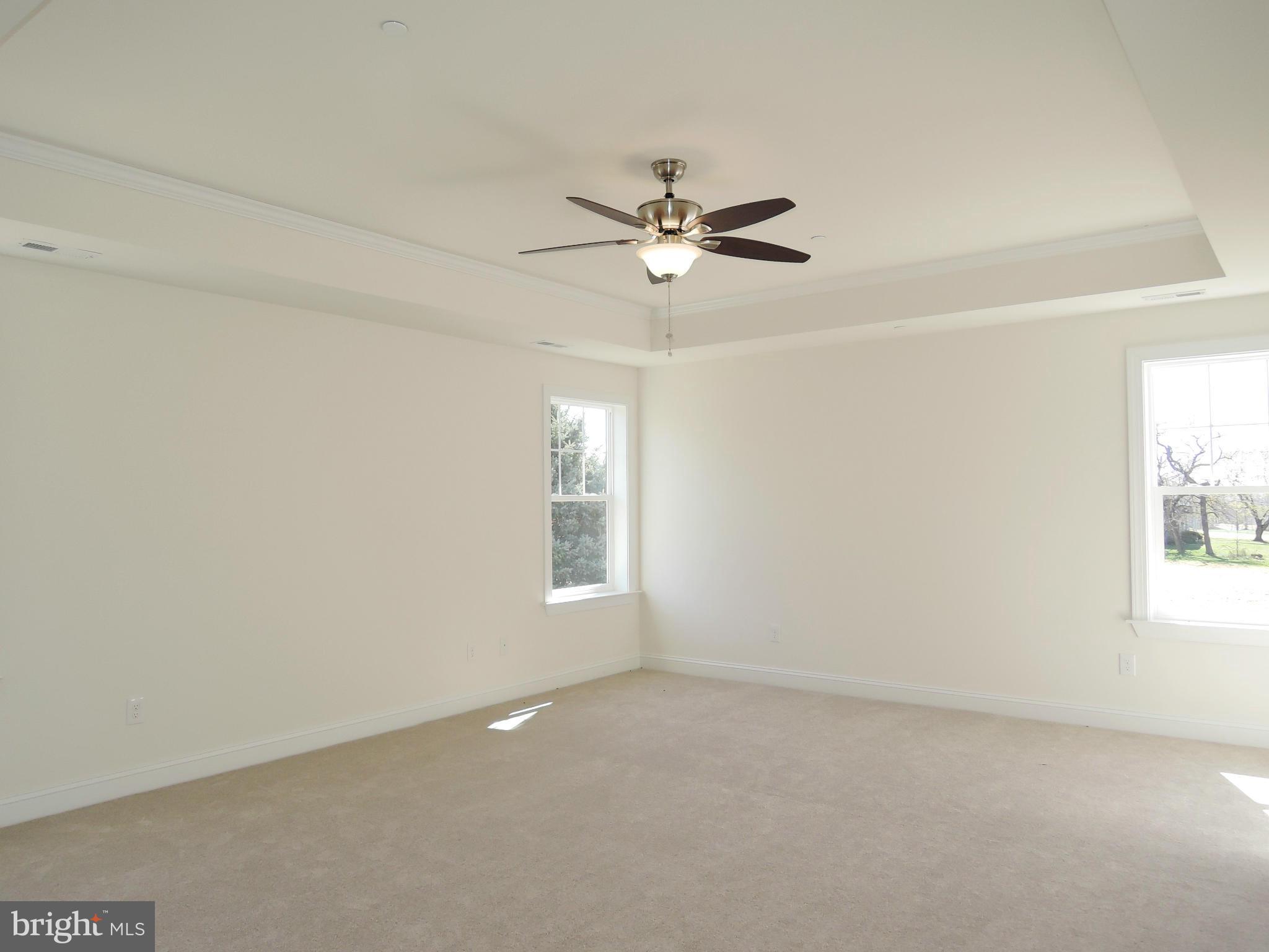 17023 Troyer Road Monkton, MD 21111 - Photo 16 of 30 an empty room with windows and fan